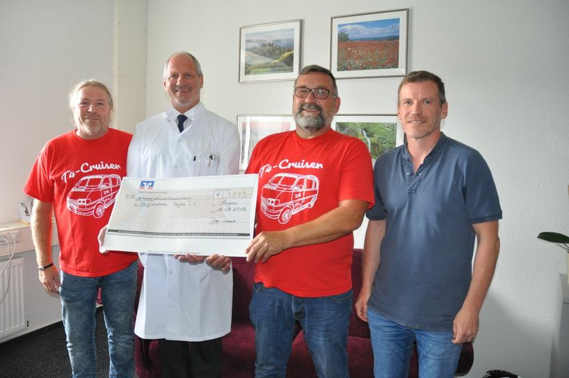 Stolze Spender und glückliche Empfänger (v. l.): Gerd Rothweiler, Dr. Michael Maasberg, Tom Breitbach und Guido Adams.